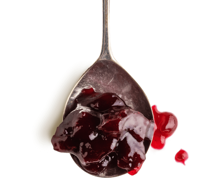 Spoonful of beetroot chutney representing custom condiment manufacturing.