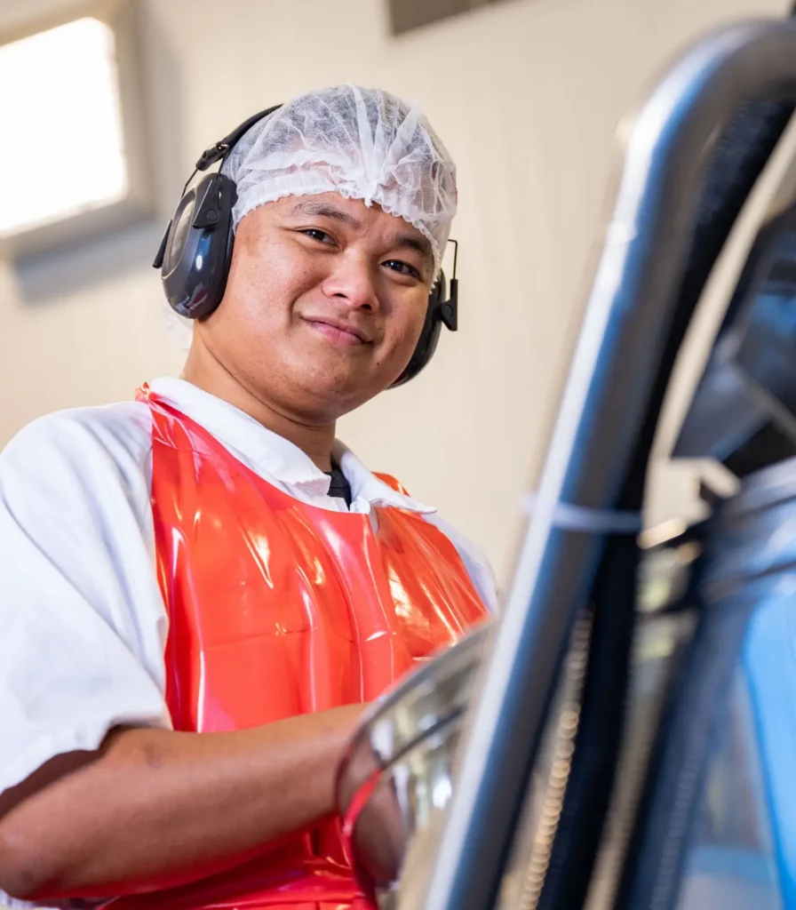 Springbrook production team member operating food manufacturing equipment