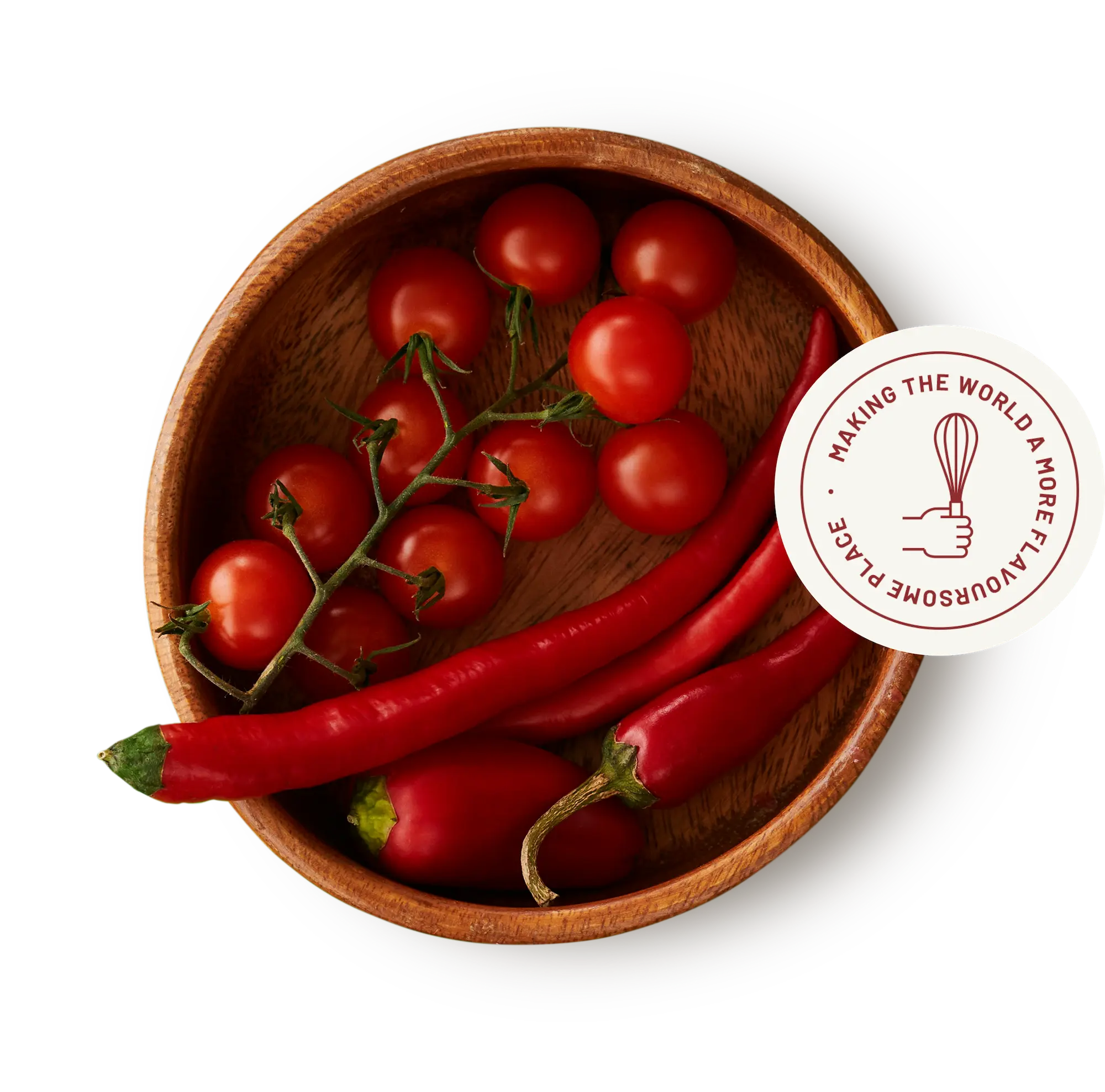 Fresh cherry tomatoes and red chillies in a bowl representing natural ingredients for sauce manufacturing
