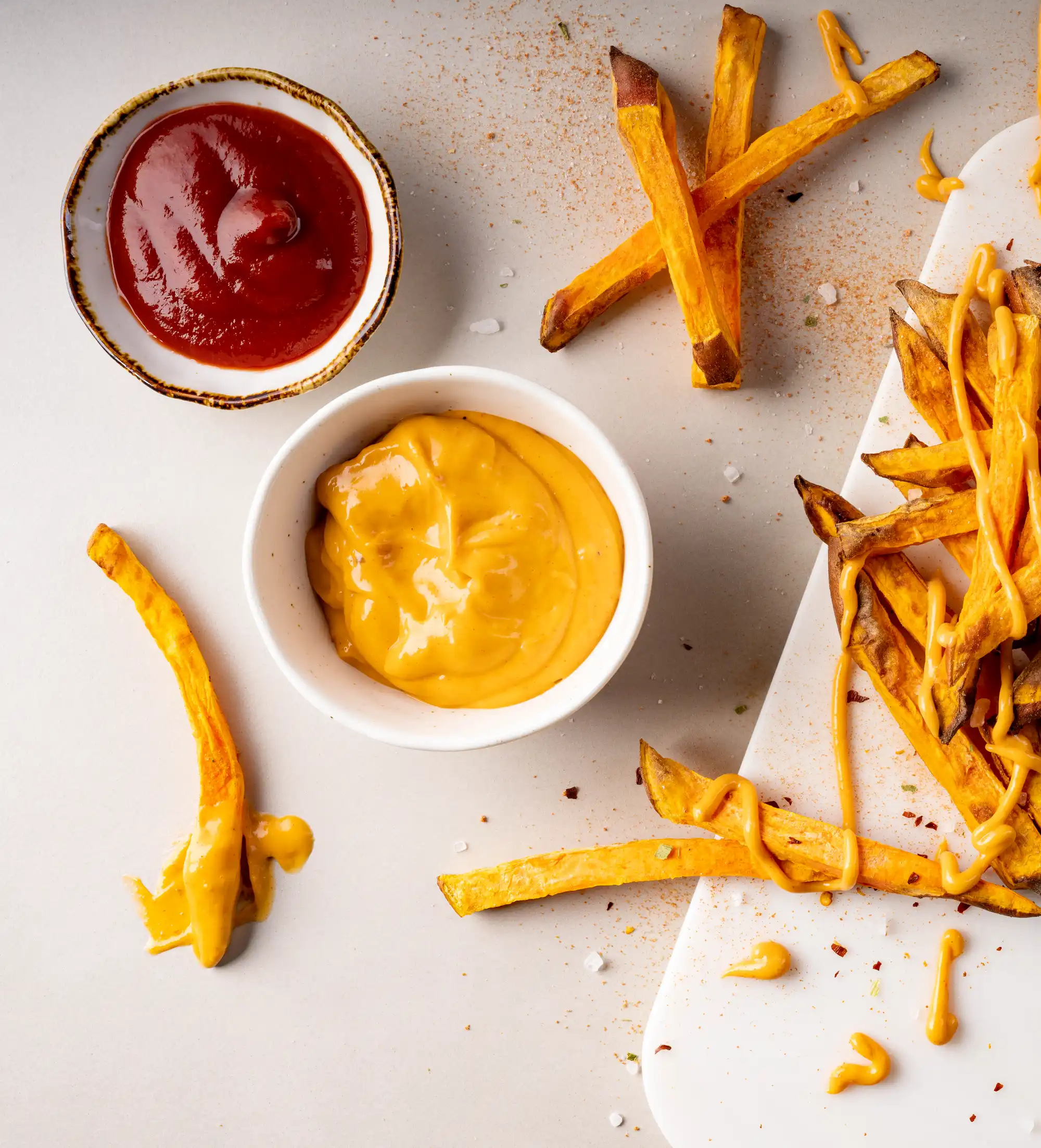 Kūmara fries served with tomato sauce and chipotle mayo